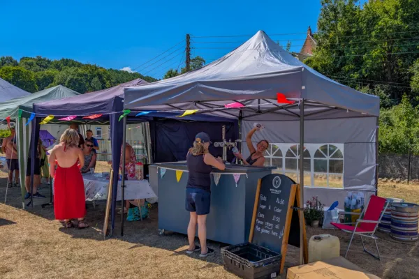 Nikki at the bar - Lydbrook Memorial Hall - Summer Fete 2025